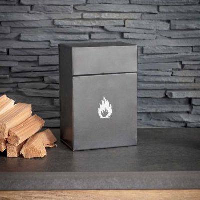 Firelighter storage box against an interior slate wall sat beside a small pile of kindling